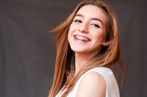 smiling teen girl with braces