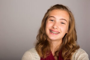 smiling teenage girl wearing braces