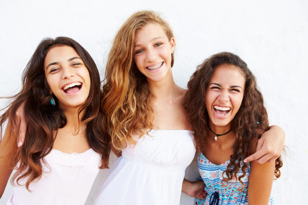 Teen girls smiling