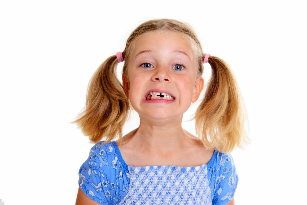 young girl with missing tooth